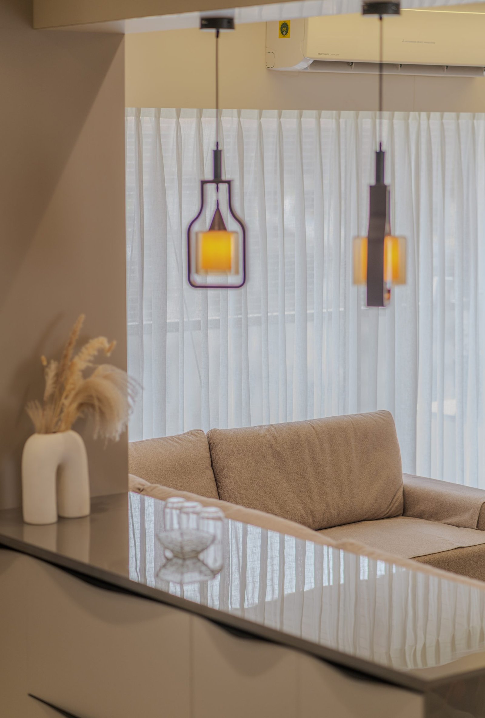 Pendant lights over the counter, Jayendra Bhai Residence by Himanshu Raval Architects